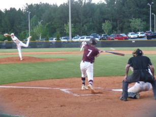 Maroon Devil Lawson Woodard connects in the first inning in the playoff game against Draughn.  