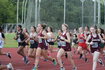 And they’re off! Lady Devils cross country take off at the Cherokee meet last week where they took first place.
