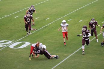 Maroon Devil ninth grader Druw Cody takes down an Andrews Wildcat on the carry.