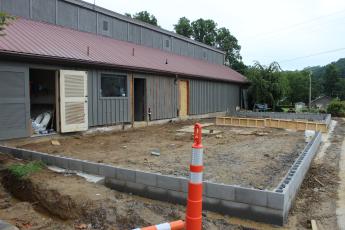 Construction takes place at the county pool where new buildings are being built including restrooms and meeting rooms.