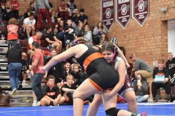 Swain wrestler Layla Alonzo grapples on the mat at the Maroon Devil Invitational, taking place Nov. 18.