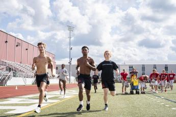 Kelan McCullough, far right, trains at Spire Academy. His goal is to be the best junior decathlon athlete in the country.