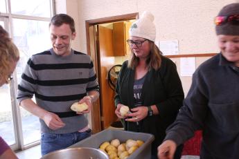 New The Giving Spoon executive director Ricky Sanford (left) and board member Misty Lynne Sneed help peel potatoes that will be served to the community, as per the nonprofit’s mission.