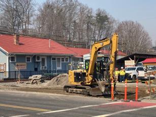 Contractors began work last week where a bus drop off will be constructed on Everett Street next to the train depot. 