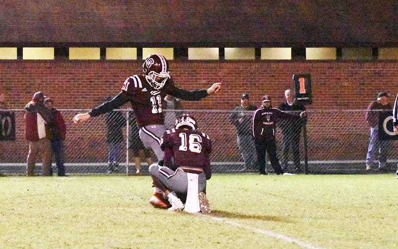 Photo by Joanna McMahan - Maroon Devil kicker and holder get ready to send the ball down the field.