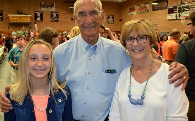 Dennis White, center, is pictured with his grandaughter Kendall Bowers and wife Debi White. 