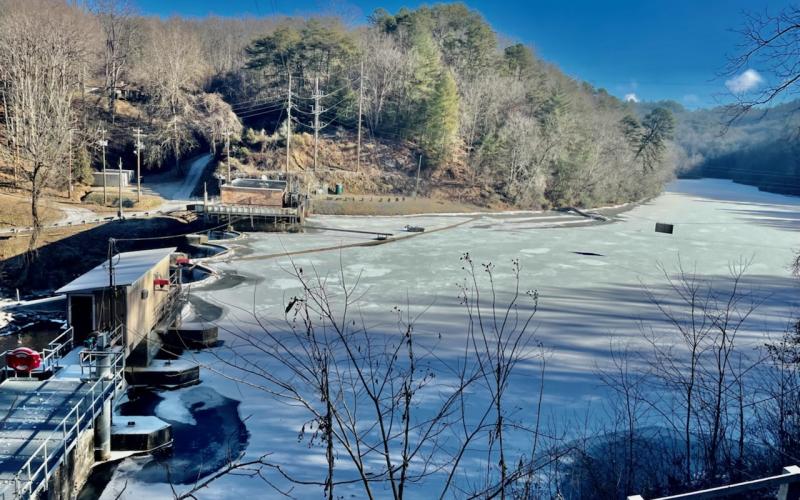 The water above Ela Dam Tuesday morning is frozen over and covered with a dusting of snow.
