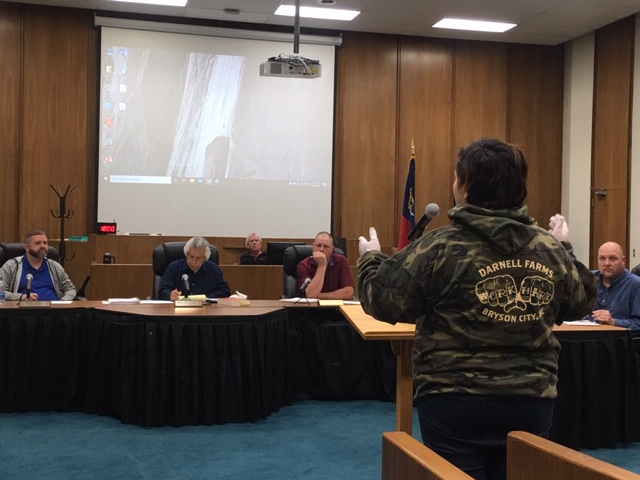 Afton Roberts with Darnell Farms speaks to the Swain County Board of Commissioners at the special called meeting Monday, where the board issued an order to close hotels and other vacation stays until further notice. 