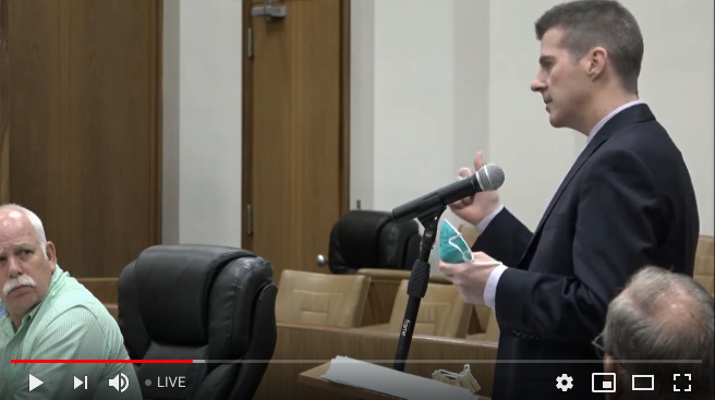 Steve Heatherly, CEO of Harris Regional and Swain Community hospitals shows the commissioners an N95 respirator mask. 