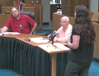 wain County Health Department Assistant Director Amber Frost addresses questions before the commissioners.