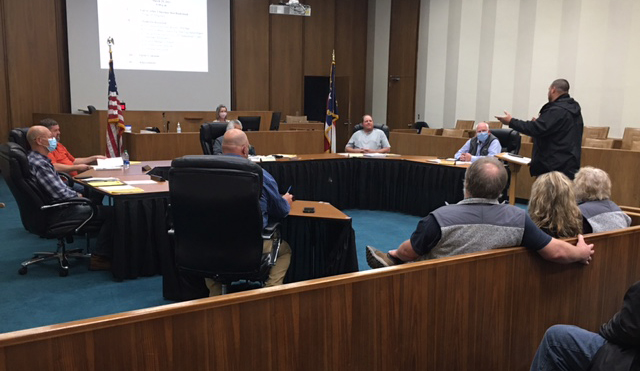 Patrick Smith (standing) speaks before Swain County Board of Commissioners.