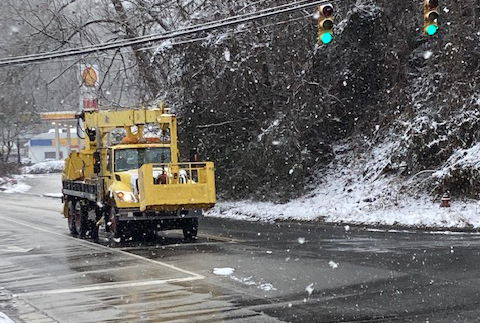 Photo by Jessica Webb/SMT A North Carolina Department of Transportation Vehicle waits at a light in town Monday morning, on its way to help with the snow cleanup and re