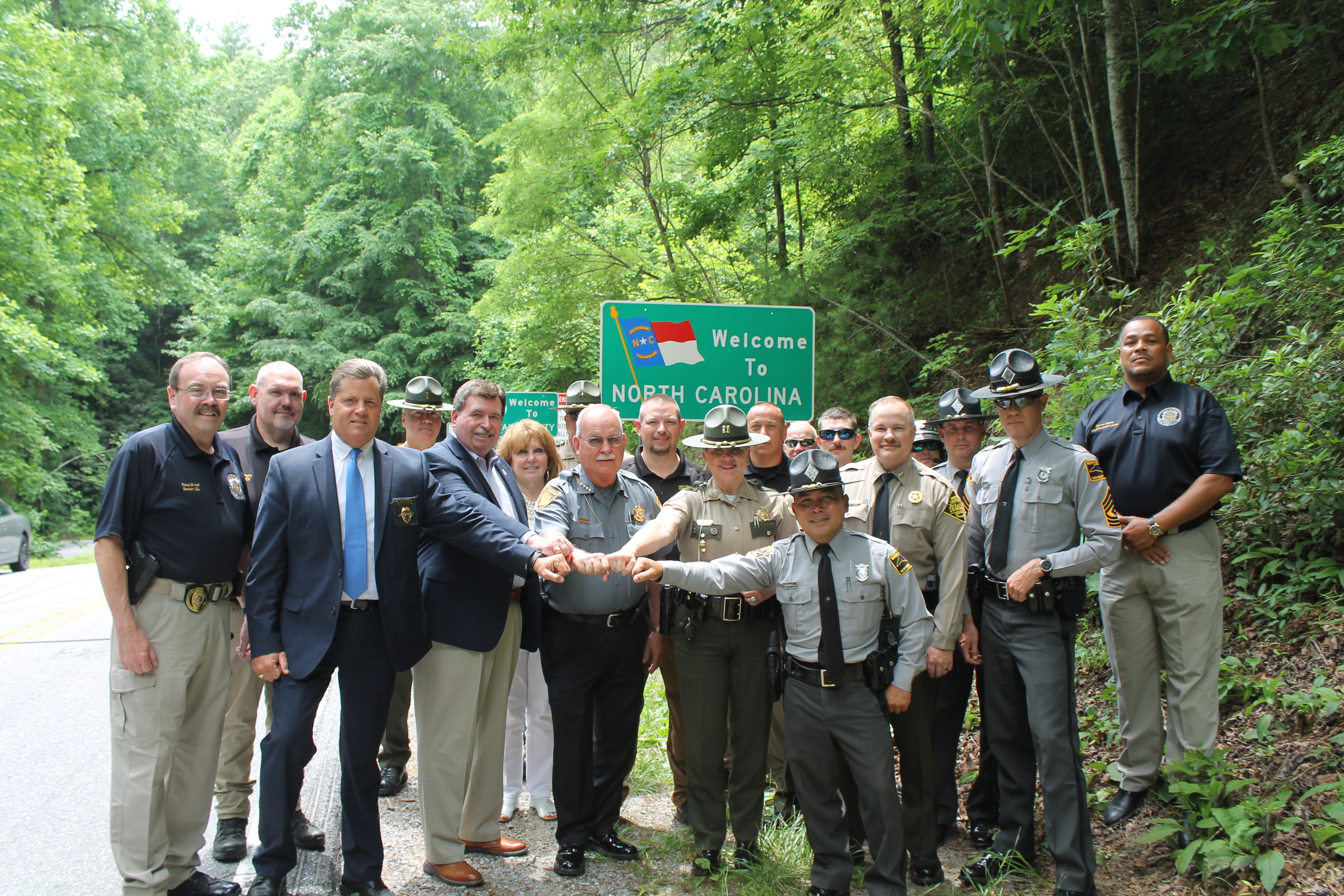 North Carolina and Tennessee law enforcement officials gathered at the NC/TN stateline on US 129 the “Tail of the Dragon” on Tuesday. This one-day safety campaign was known as “Border to Border” and was intended to promote safety along the curvy, mountainous road with 318 curves in only 11 miles. Swain County Sheriff’s Office and NC Wildlife Officers also attended the event.