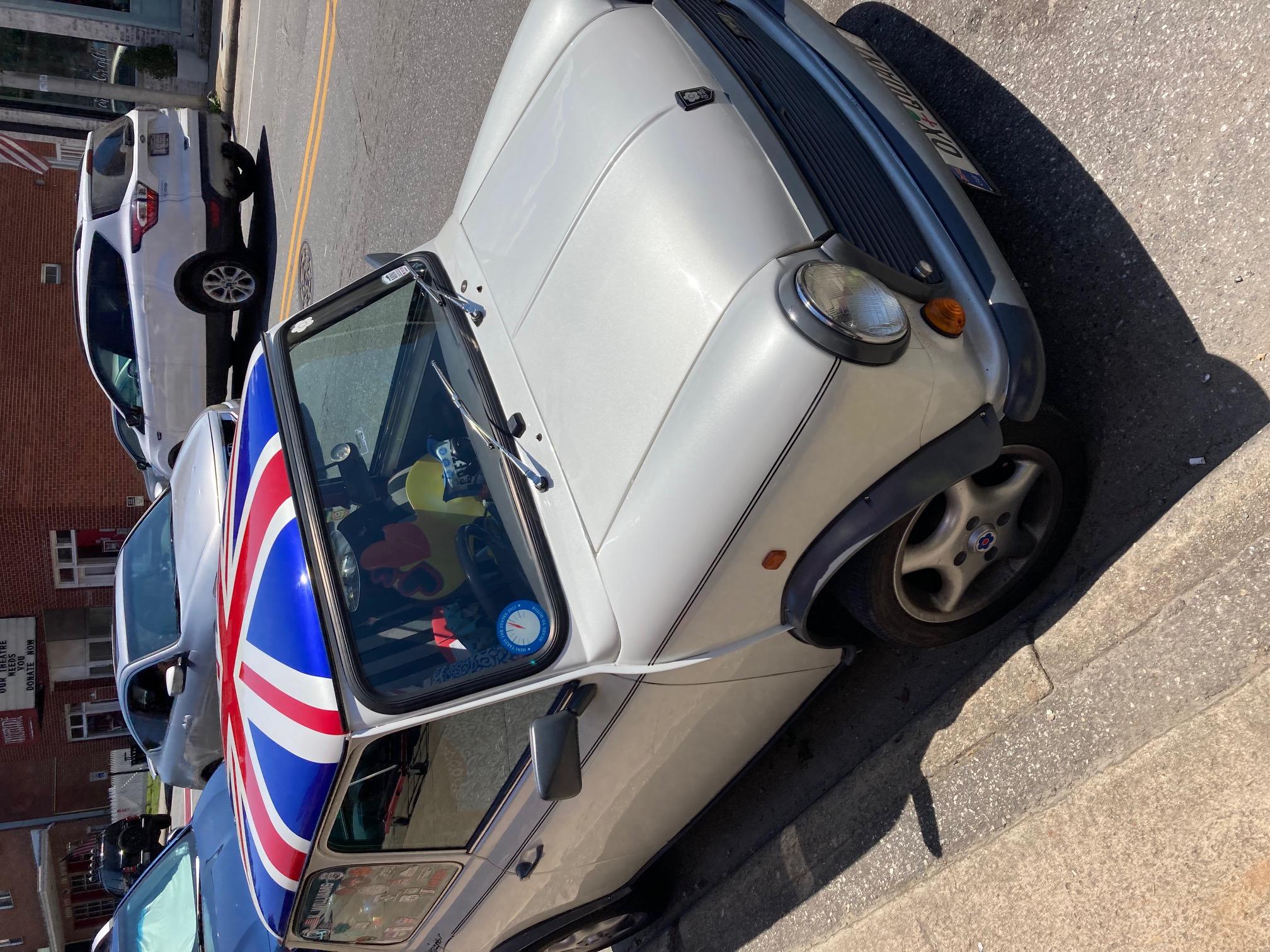 A classic mini is parked on Main Street