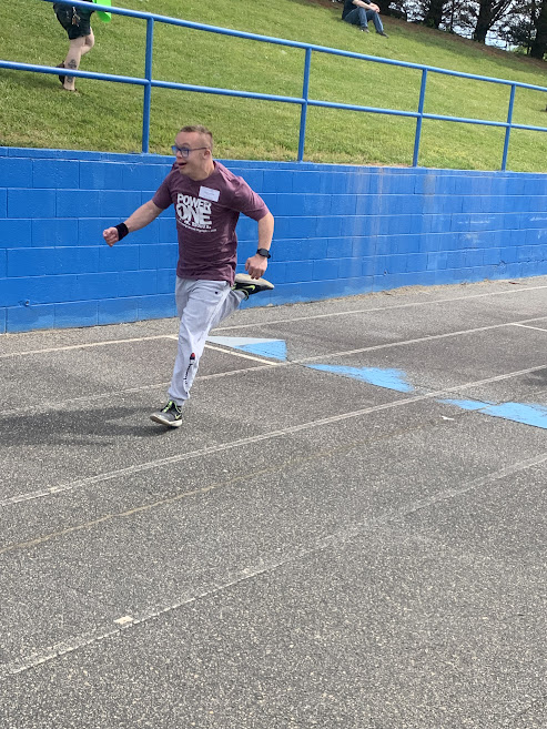 Josiah Bjerkness sprints toward the finish line in the 100-meter dash.