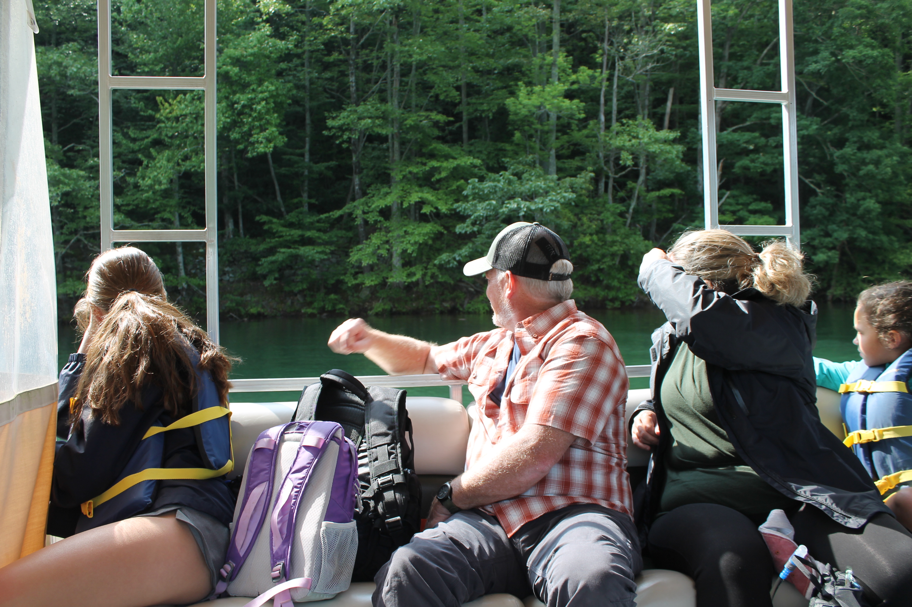 Passengers on the way to Hazel Creek admire the view from the boat ride from Cable Cove.