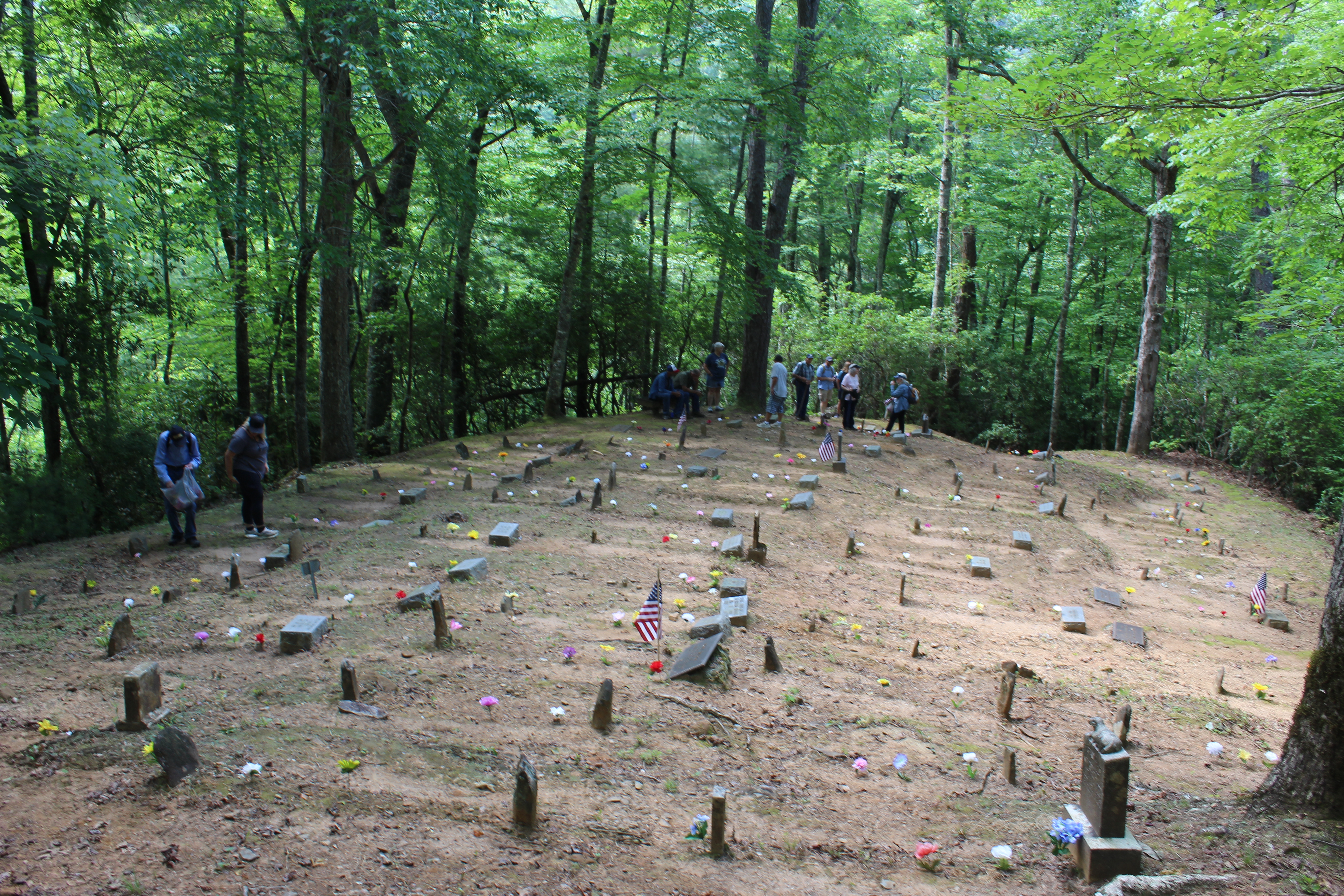 People gather to decorate the graves at Bone Valley Cemetery, one of several located on the North Shore of Fontana Lake.