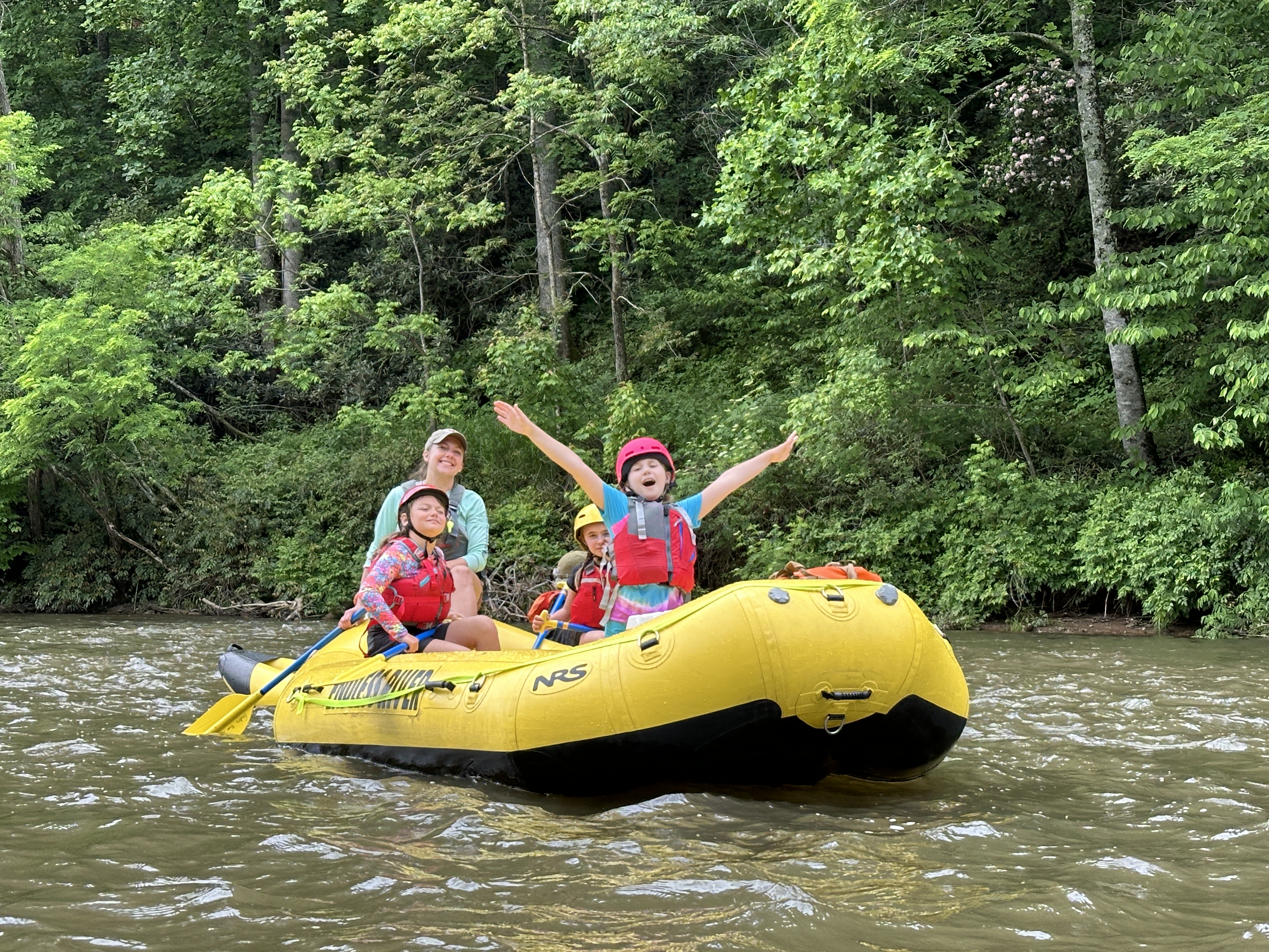 Camp activities include rafting.