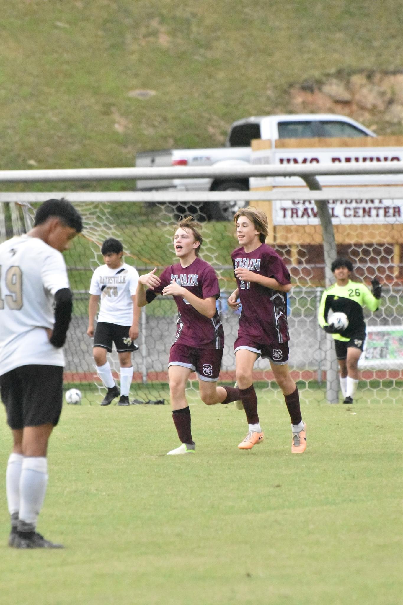 From left, Maroon Devils Clayton Shuler and Homer Lawless celebrate a goal.