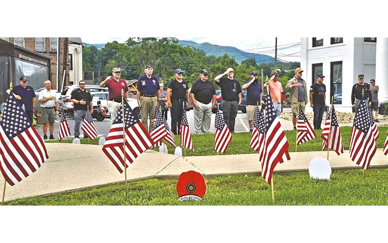 Veterans line up to honor the men and women who gave their lives in service to the nation at the veteran’s monument outside Swain County Visitor Center and Heritage Museum on Memorial Day, May 25.