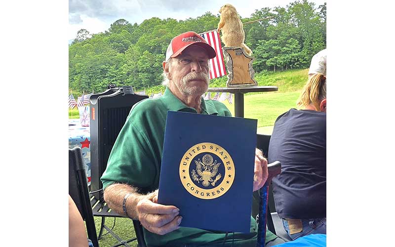 Photo/Sara Eisinger - US Navy Vet. Robert “Bob” Pillow receives formal, official tribute from Congressman Chuck Edwards, honoring the veteran's military service and serving as a permanent public record of his dedication to the country on Flag Day 2026, June 14.