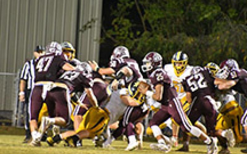 Swain Maroon Devils offensive line holds off the Murphy defense to give quarterback Damian Lossiah a path to the end zone. The game had strong defense on both sides with Murphy taking the win 15-14. 