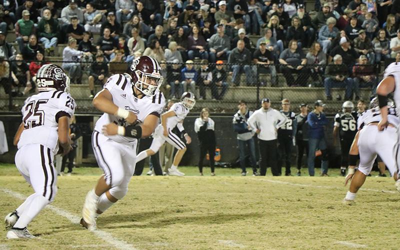 A Maroon Devil fakes having the ball