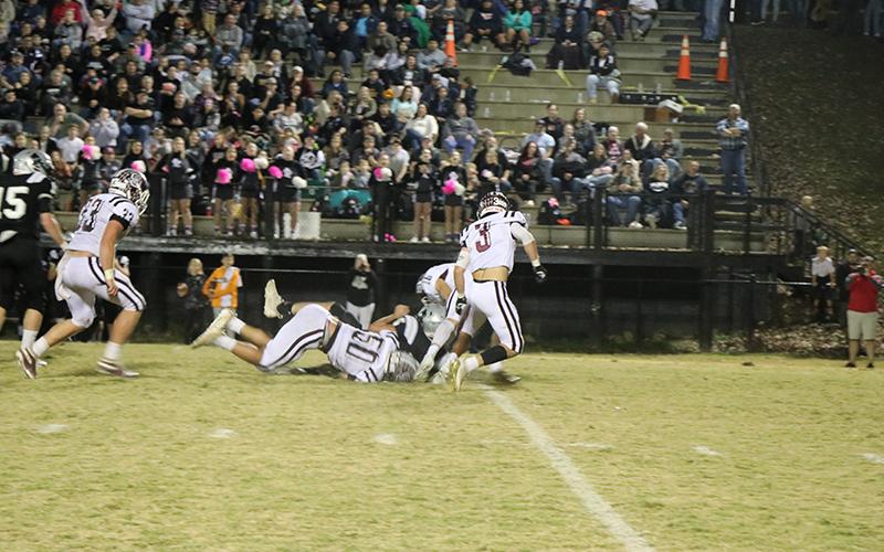 A Maroon Devil tackled a Black Knight