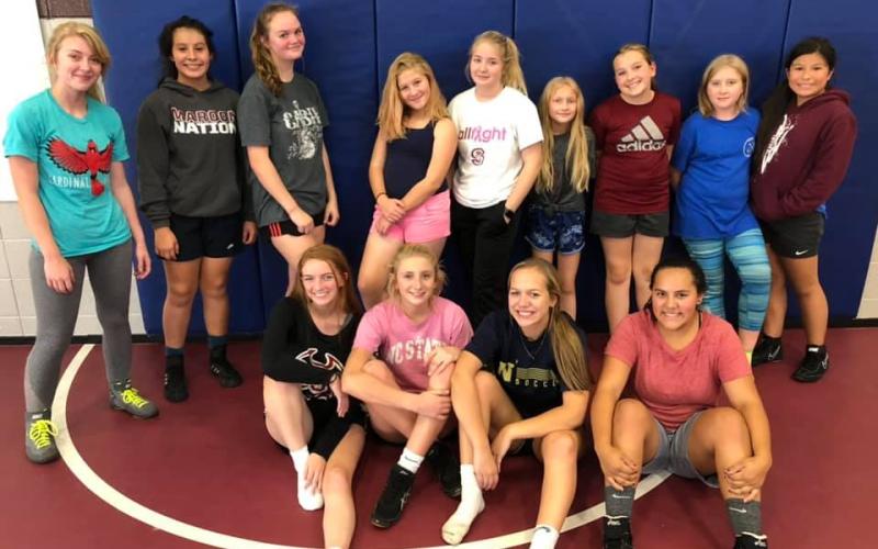 The new Swain High Lady Devils Wrestling team is pictured after their first official practice on Oct. 30. Some have competed on co-ed teams in the past and for others, the sport is new.