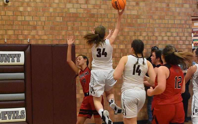 Swain County Lady Devil sophomore Angel Parsons scores in the season opener win against the Lady Wildcats.