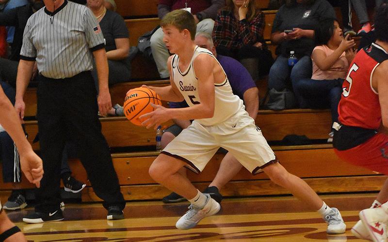 Maroon Devil Connor Hyatt advances the ball