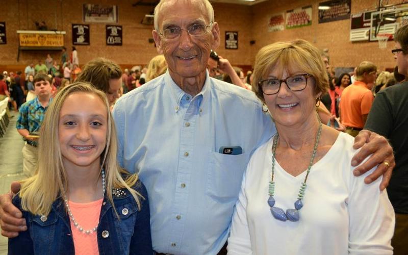 Dennis White, center, is pictured with his grandaughter Kendall Bowers and wife Debi White.