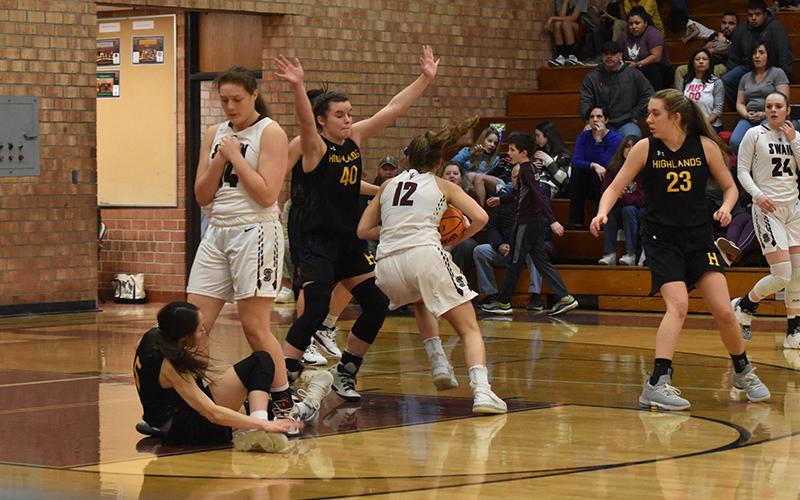 Swain Lady Devil Maddie Spates drives the ball toward the net in the home loss against the Lady Highlanders.