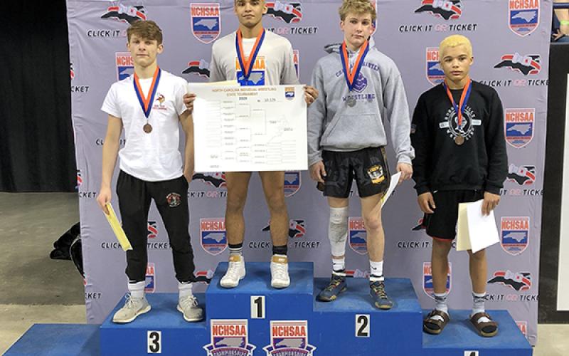 Jonas Trejo stands on the podium with the other athletes