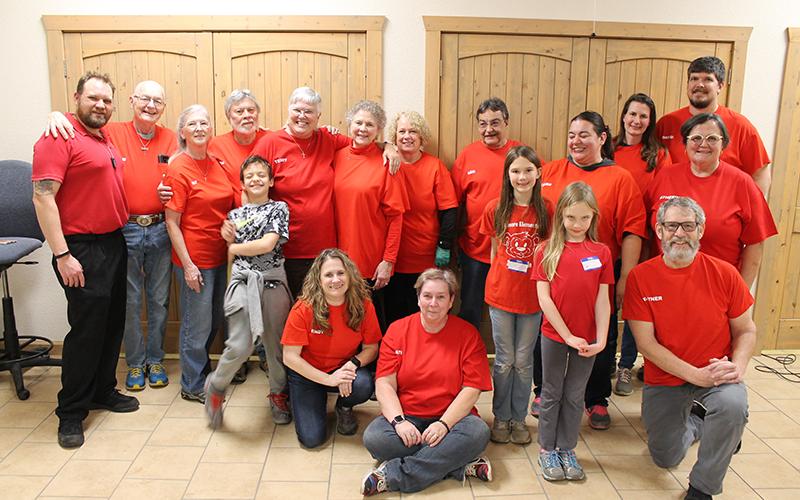 Pulling off the first Pass It On Cafe´was no small task. This large group of volunteers are pictured after the event, with organizer Dr. Pati Graham seated in the center. The event will be ongoing, held on the last Tuesday of each month.
