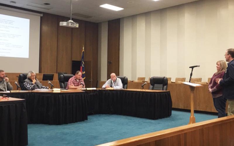 Swain HD Director Alison Cochran and Schools Superintendent Mark Sale speak to commissioners Thursday night.