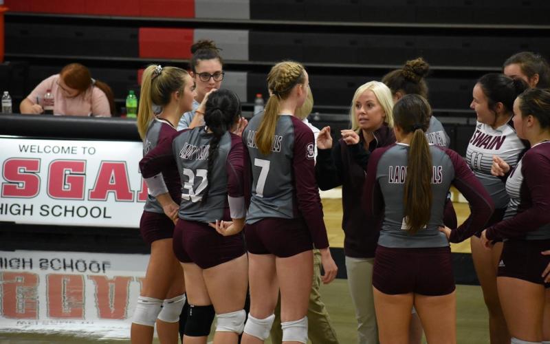 Coach McMahan talks to her volleyball team