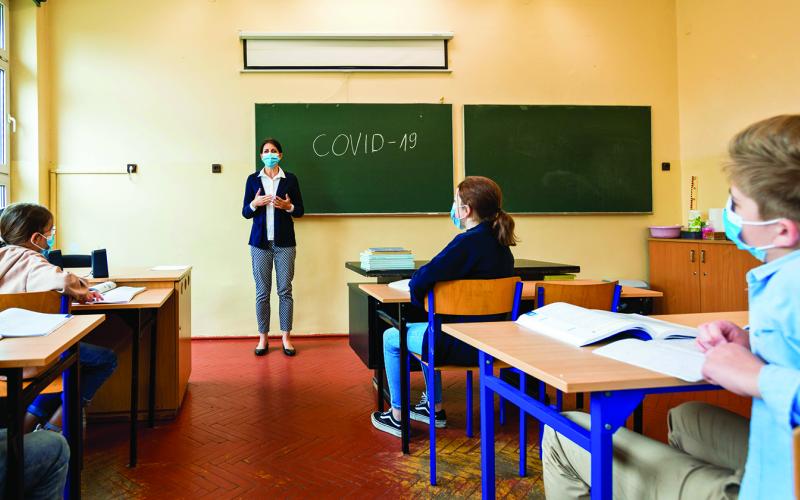 Students and teachers will wear masks and social distance