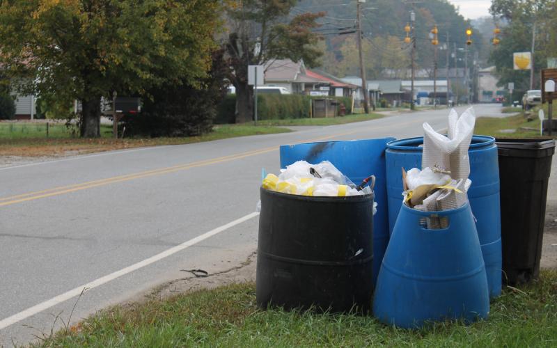 trash waiting for pickup outside a business on Bryson Walk