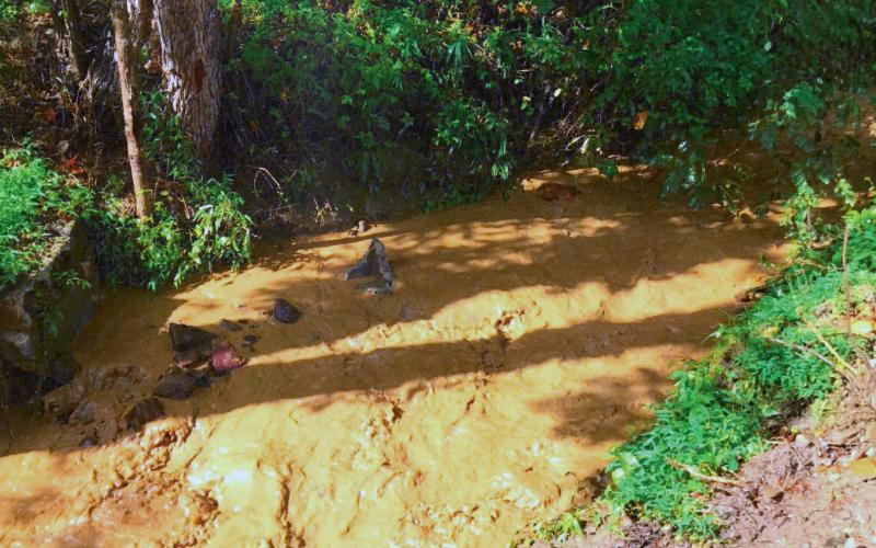 A tributary on East Alarka overflowed and ran brown just after a heavy rain this summer.