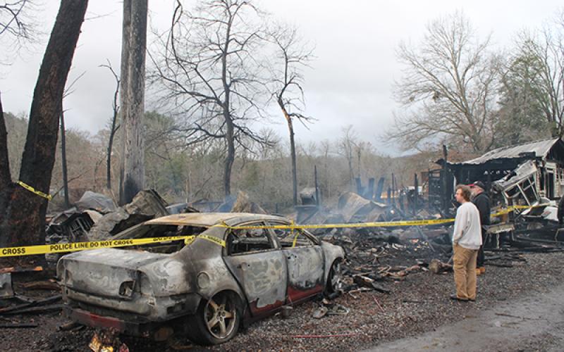 Two former residents survey the damage left behind
