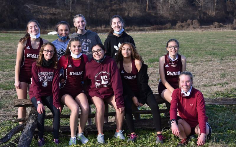 Photo by Joanna McMahan The Lady Devils cross country team is pictured at the beginning of the season. The first part of this short season has been a strong one for the team.