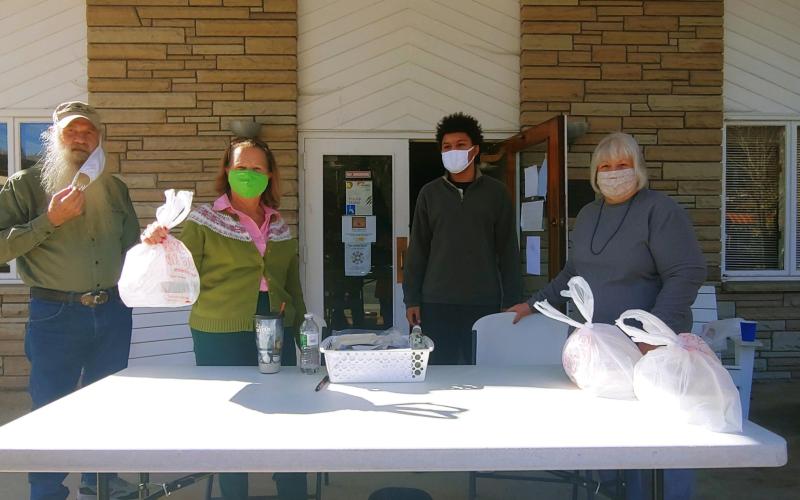 Giving Spoon volunteers provide the to go meals