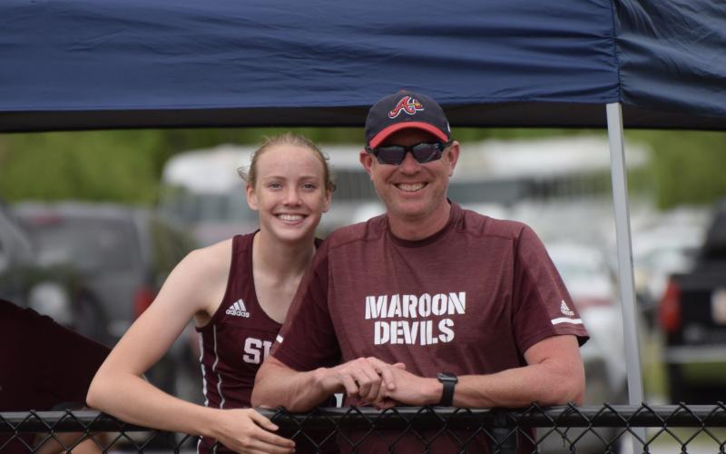 Jenna and Jeff Marr at a track meet where Jenna ran