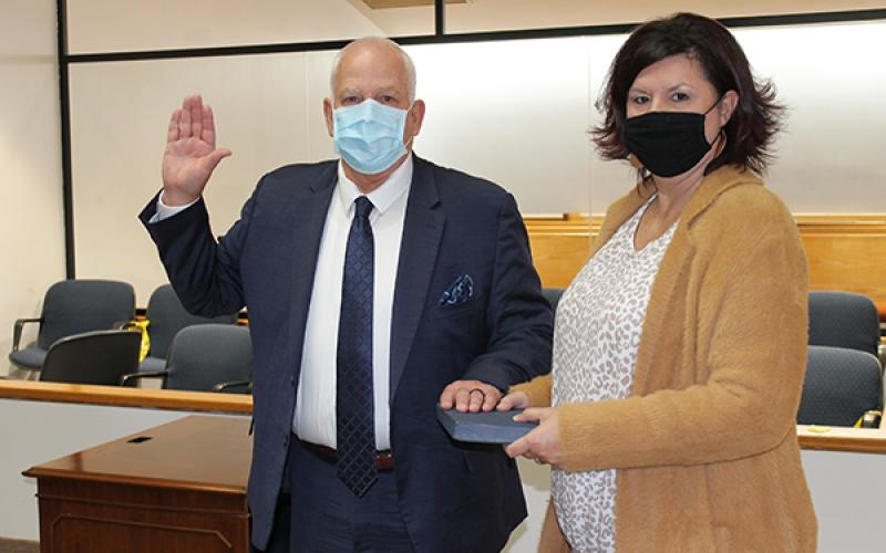 Roger Parsons swore an oath of office for his next term on the Swain County Board of Commissioners on Monday. He’s pictured with his wife, Ginger Parsons.