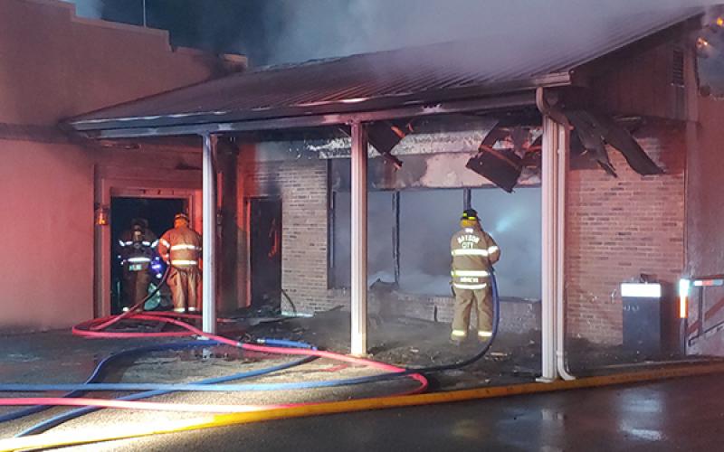 ocal firefighters fight a fire that started in the basement floor below the old service station section of a vacant funeral home on Main Street in the early hours of Saturday morning.