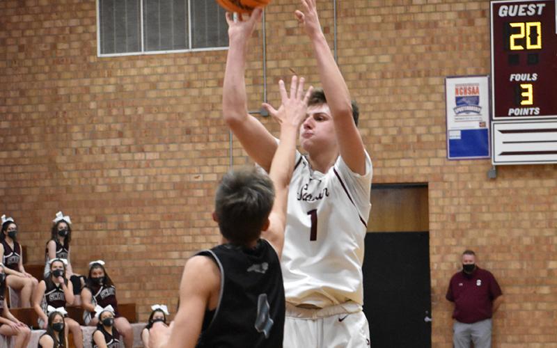 Maroon Devil Carter Kirkland takes a shot in the away game against Robbinsville.