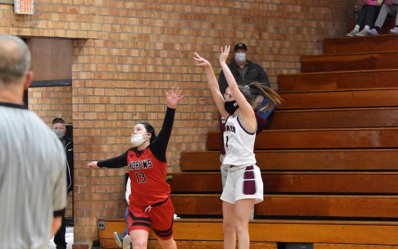 Lady Devil Amaya Hicks makes a 3 point shot in the home win against Andrews Saturday.