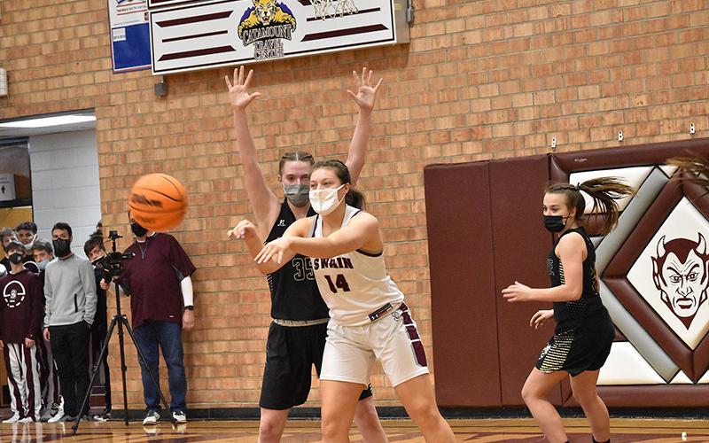 Lady Devil Savannah Smith makes a successful pass in the home win against Hayesville.