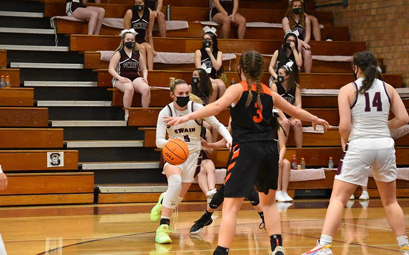 Lady Devil Mazie Helpman drives the ball in the home game against Rosman
